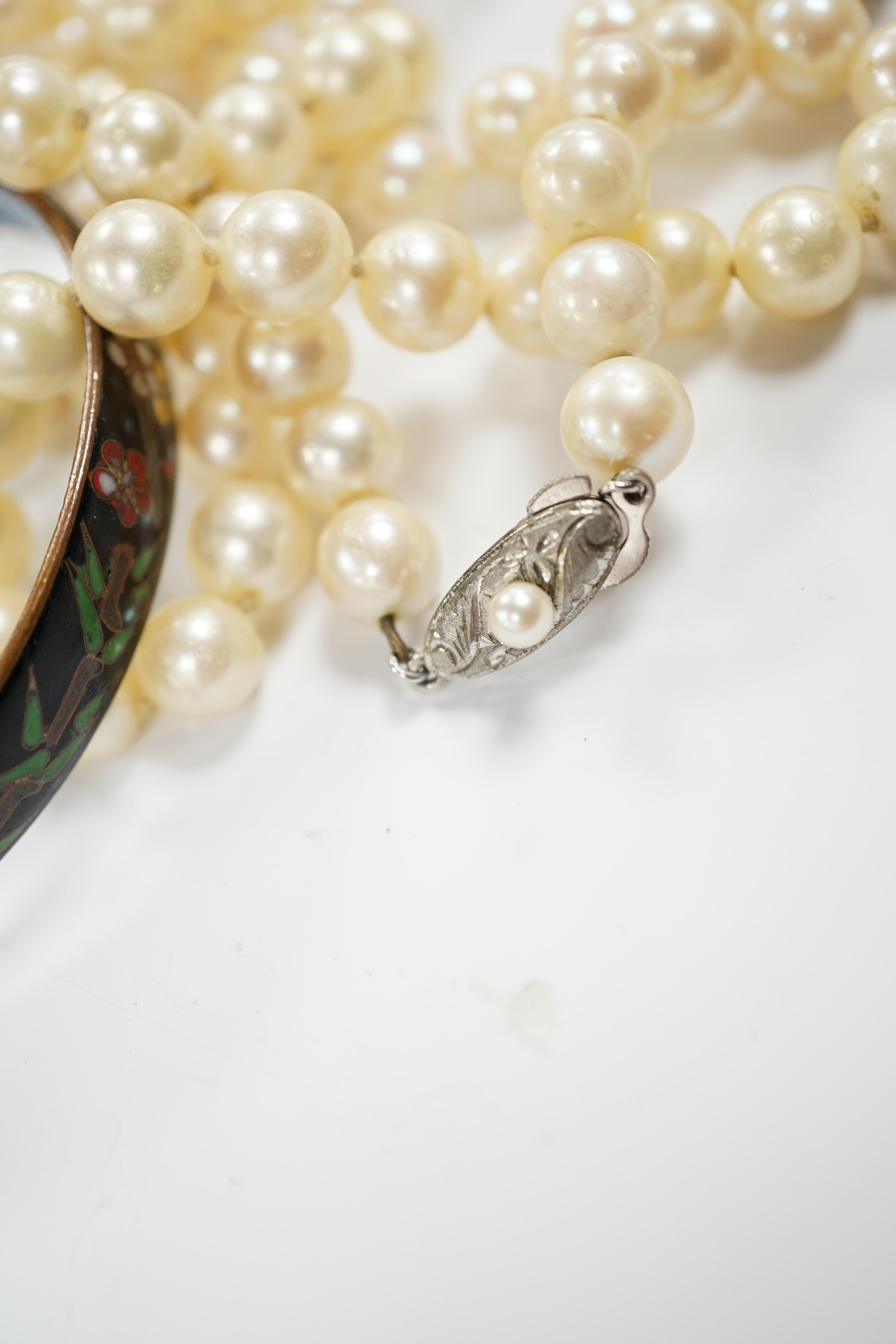 Two single strand cultured pearl necklaces, one with 9ct, white opal and cultured pearl set clasp, 40cm and a cloisonné bangle.